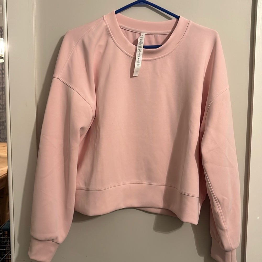Soft stream light, pink crewneck sweatshirt
